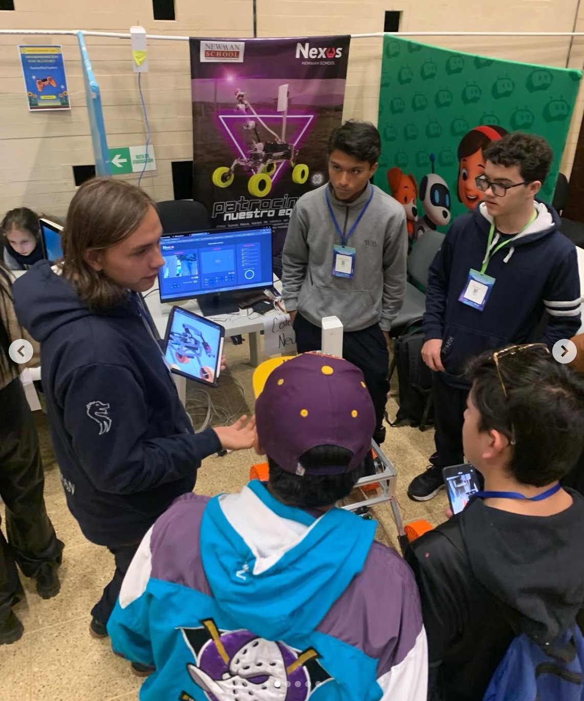 Team presenting with rover